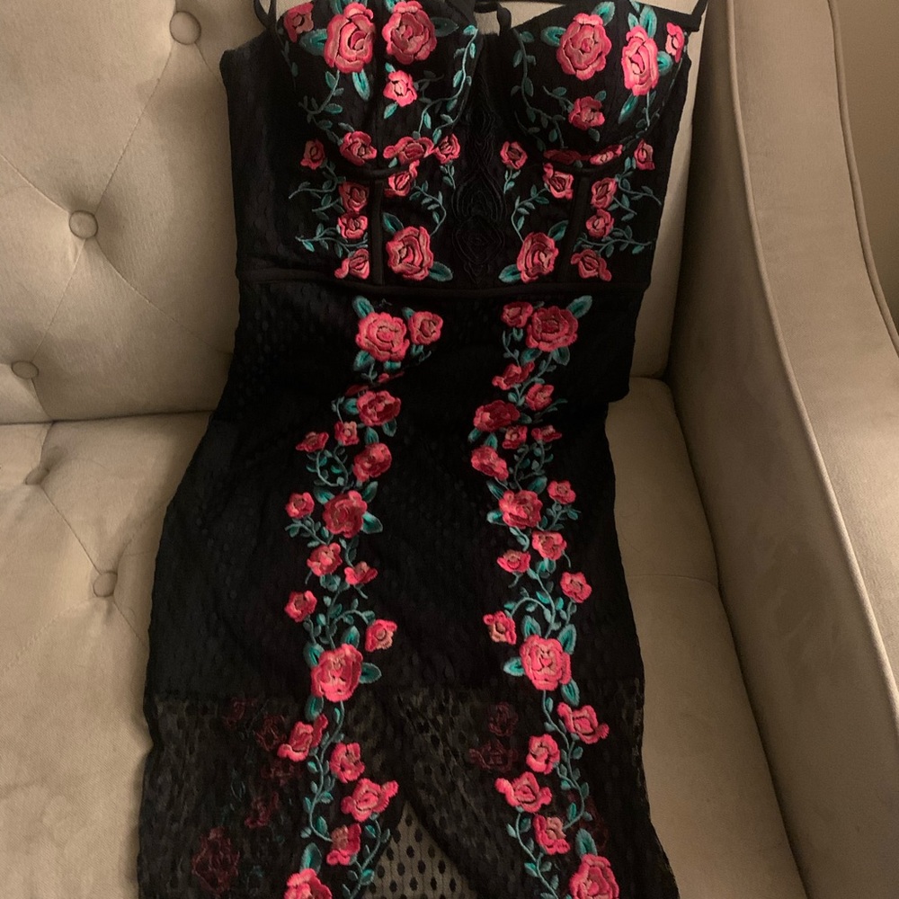 black dress with pink roses and green stems
